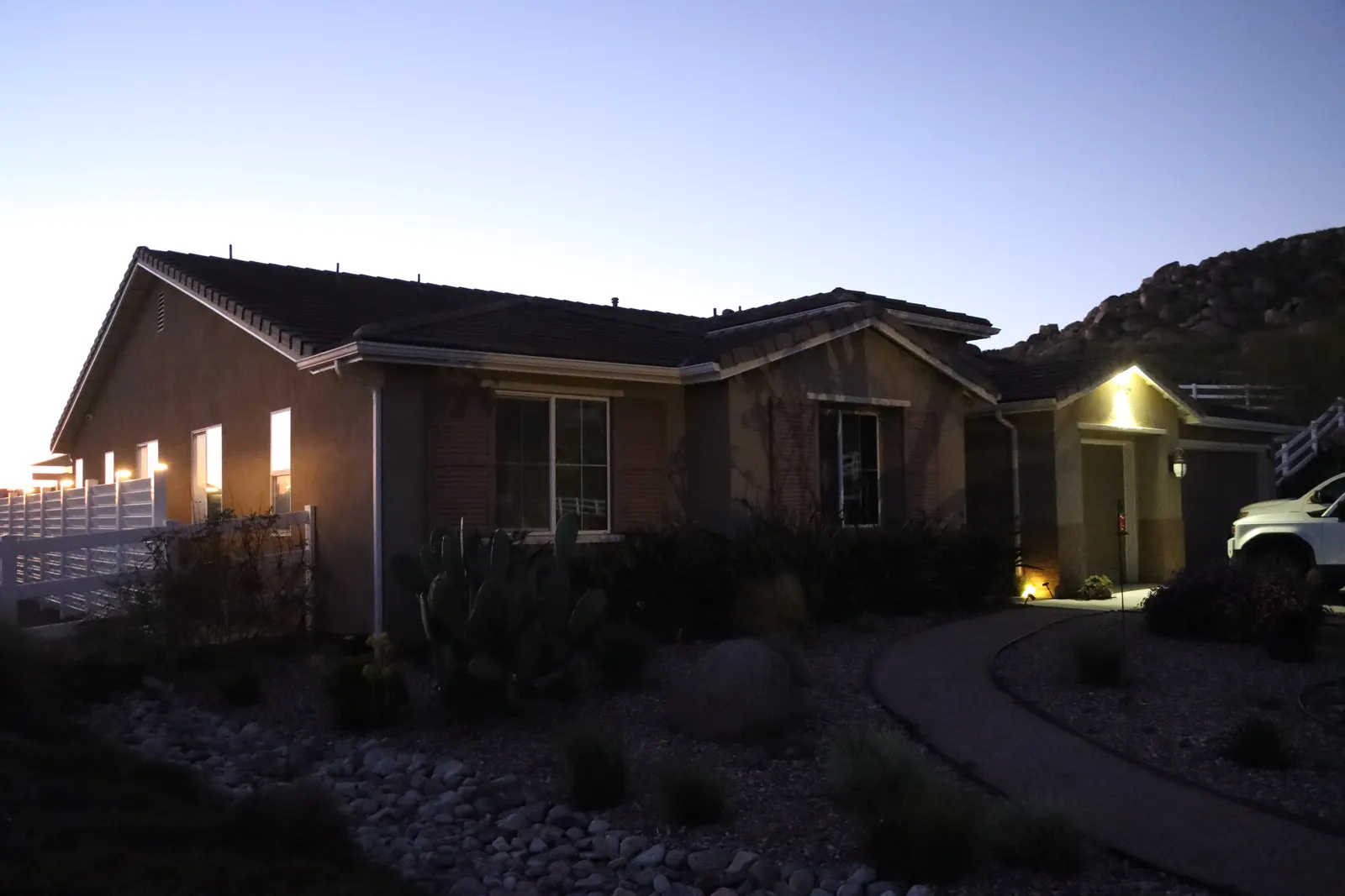 Authorized 5280 Signature system photography: the same home at dusk with the roofline lights off