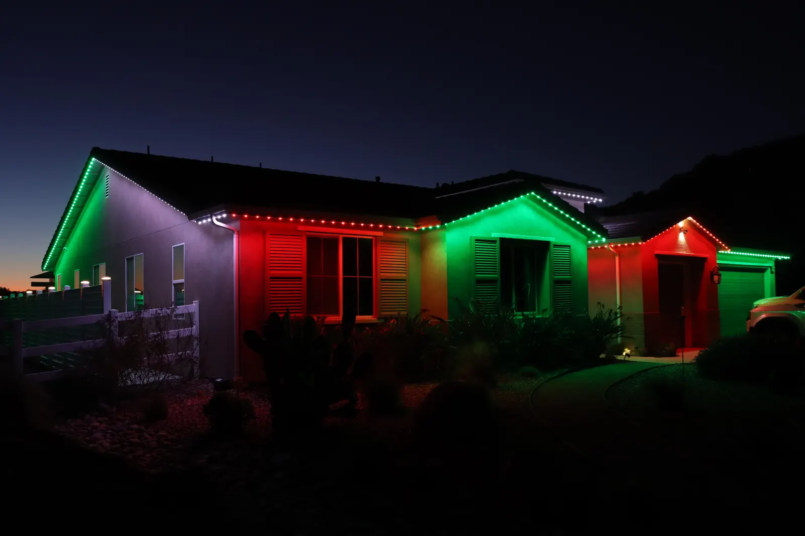 Authorized 5280 Signature system photography showing red and green holiday zones along the roofline