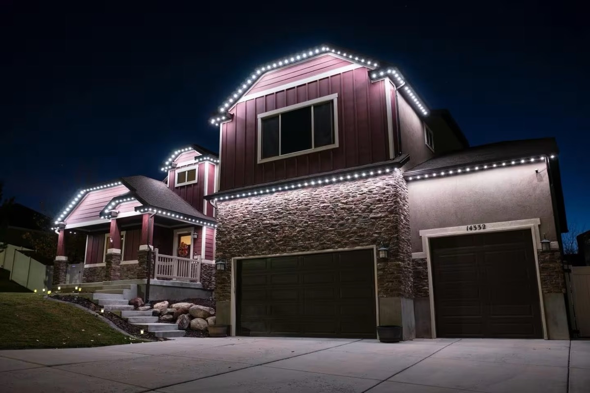 Warm white Strata lighting outlining a two-story home