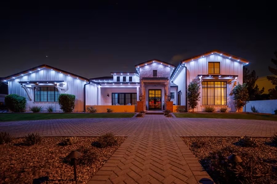 Ranch home with bright warm white permanent lighting