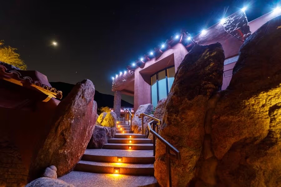 Warm white Strata lights along a two-story roofline
